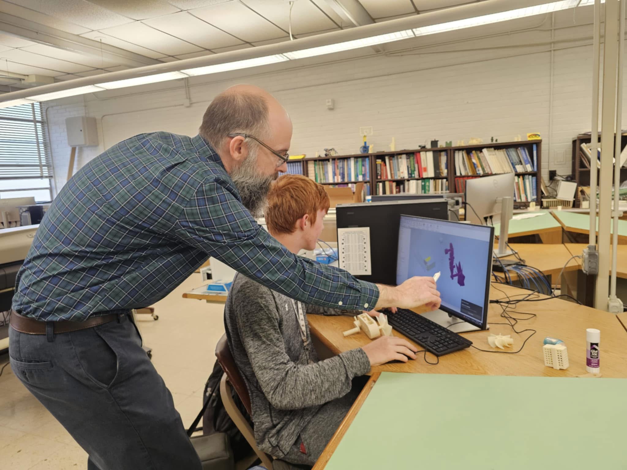 Mr. Shillings helping a student.