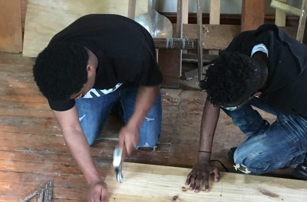 CCTC Carpentry students help with remodeling/repair  of house to be used for summer kids program.